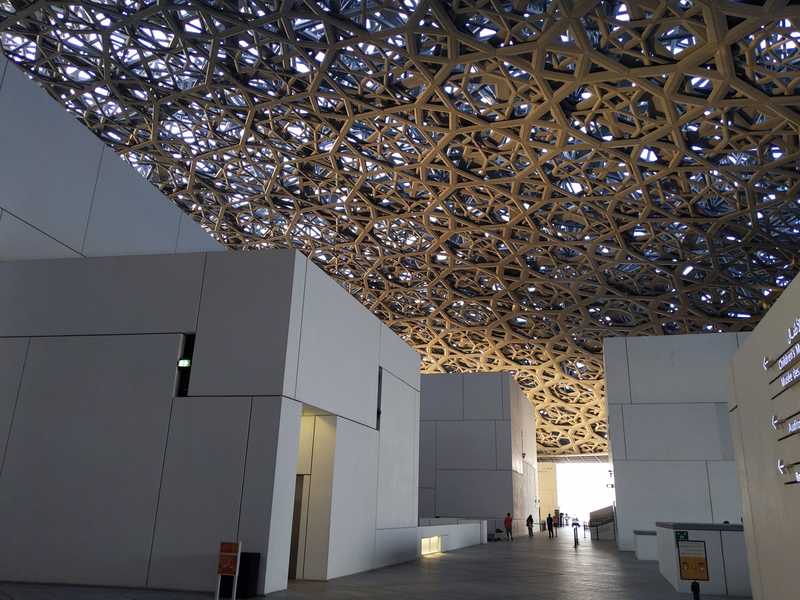 The bird's nest roof of Louvre Abu Dhabi.
